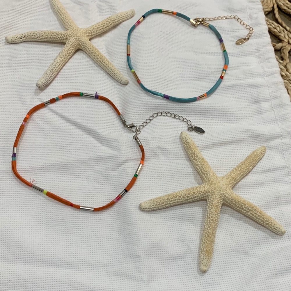 Bundle up with two chokers. One orange and one turquoise.